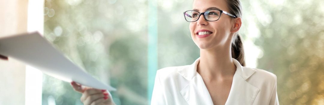 About Feature Image - Woman handing over Mortgage Document