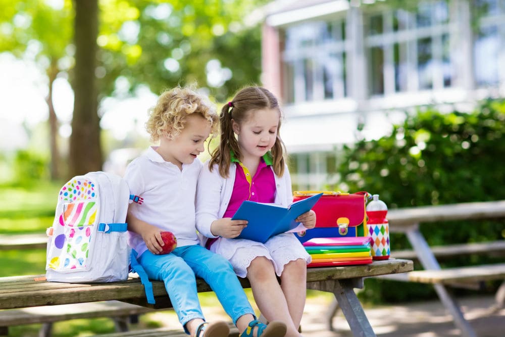 back-to-school-park=place-finance-little-girls-books-school-sitting-on-a-bench