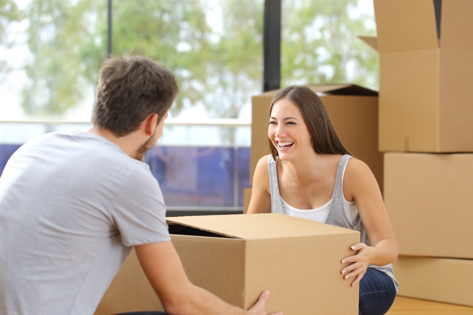 First-Time-Home-Buyers-Young-Couple-Lifting Box-Moving-Park-Place-Finance