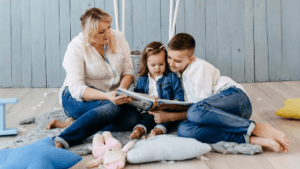 mom with children reading a book